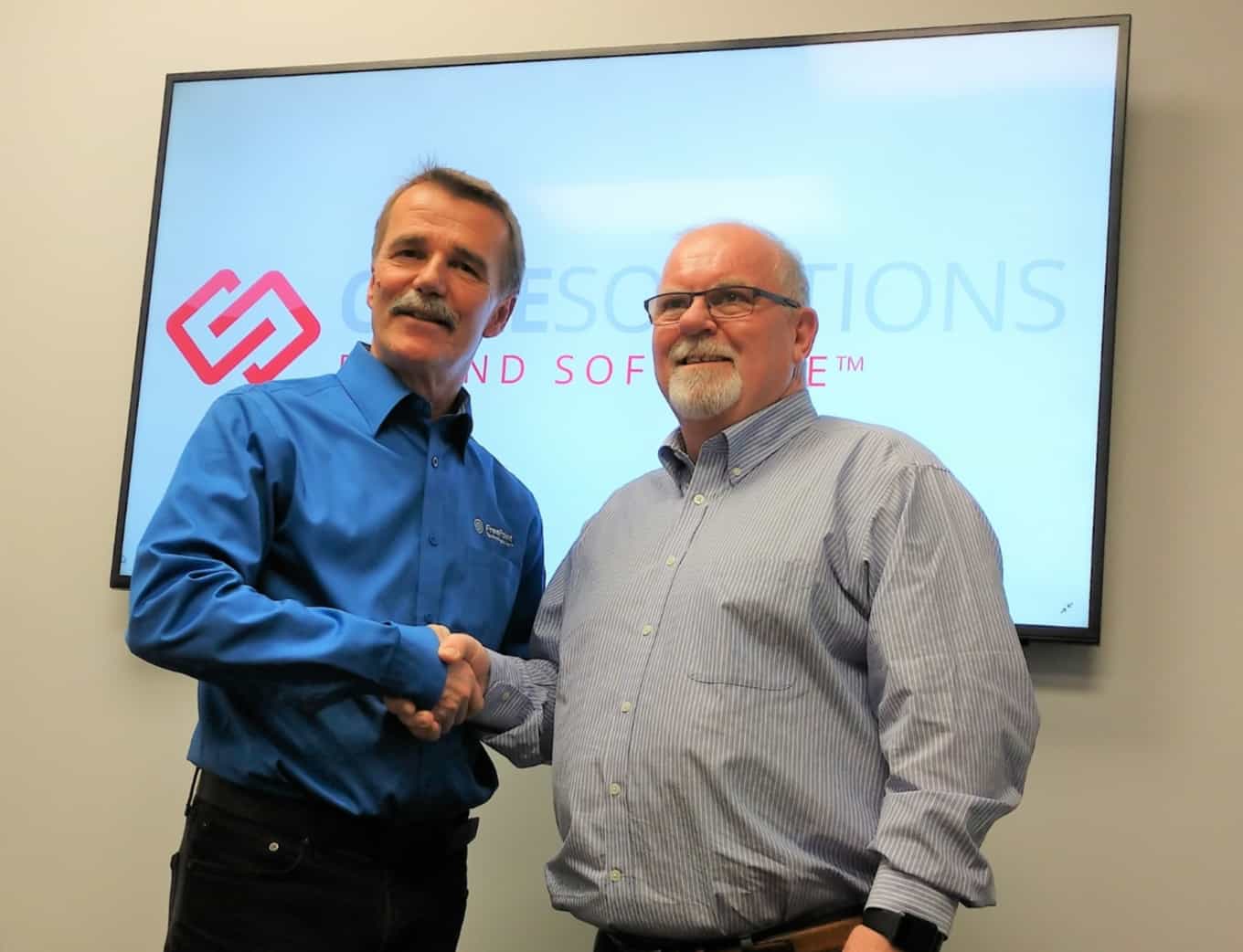 FreePoint and CoreSolutions CEO Shake Hands